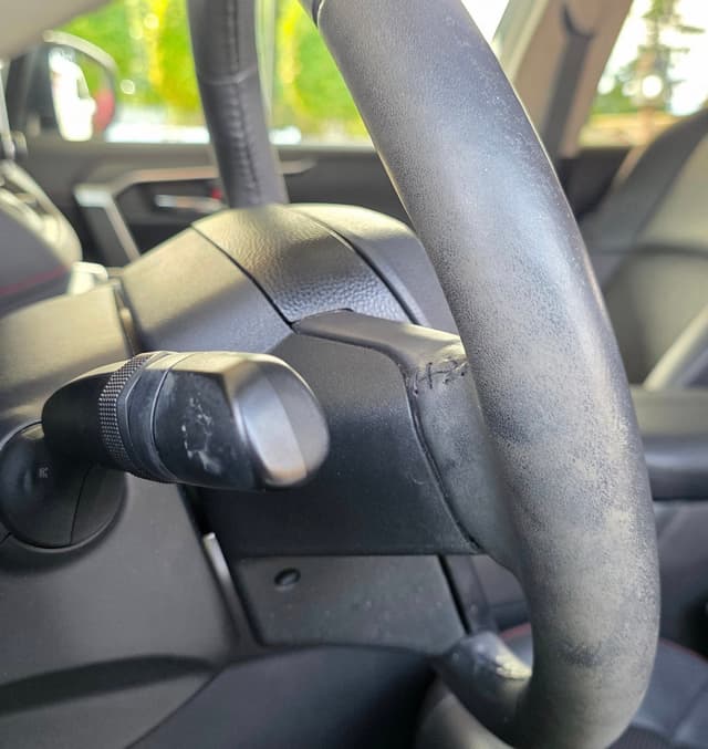 a steering wheel before detailing