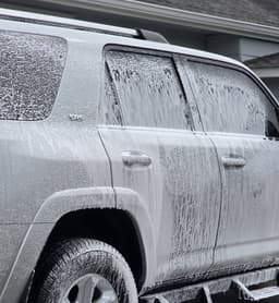 a vehicle covered in suds