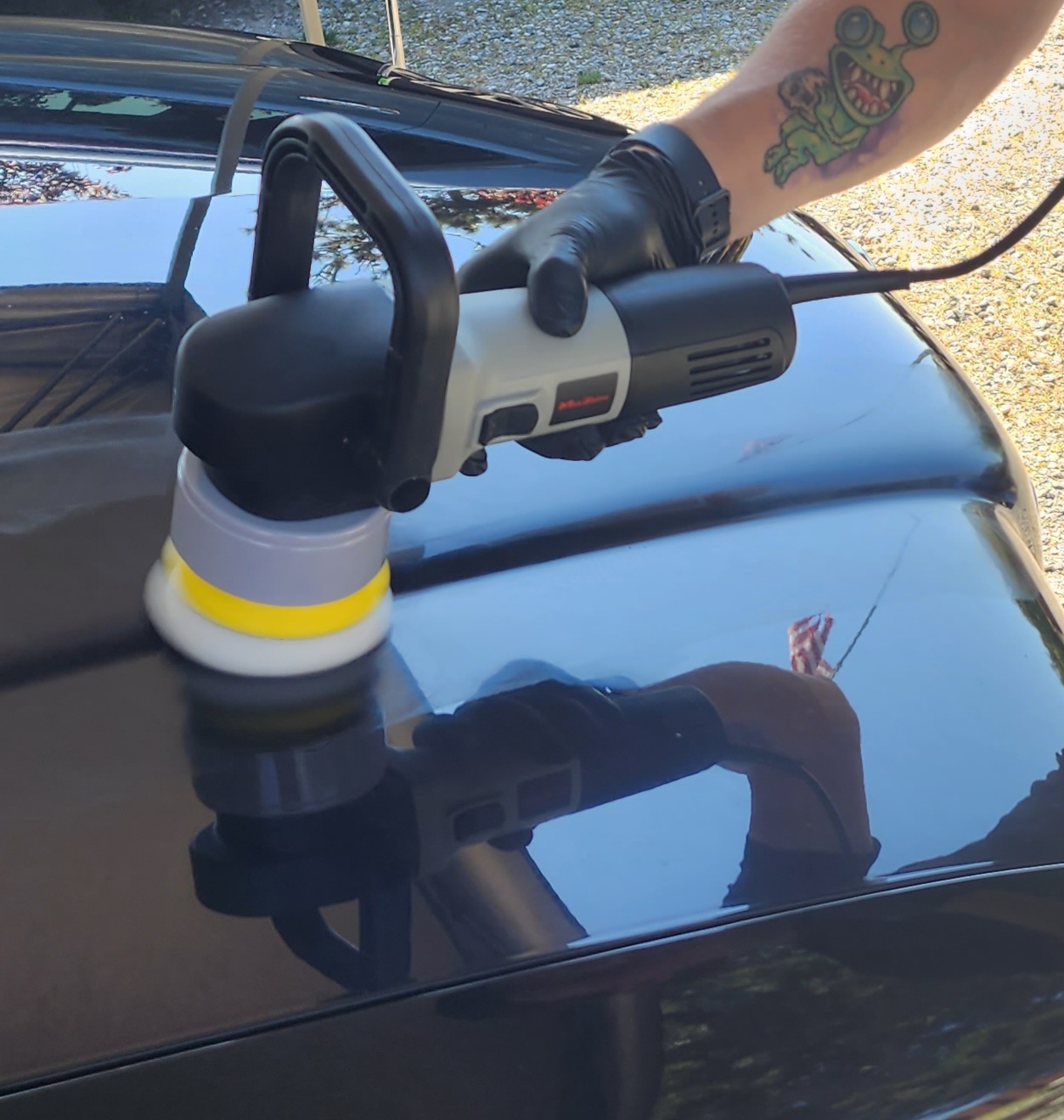 a polisher on a car